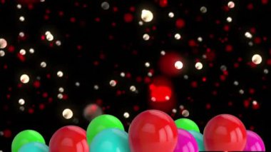 Siyah arka planda parlayan noktaların üzerinde renkli balonların canlandırılması. Yeni yıl, gelenek ve kutlamalar dijital olarak üretilen video konsepti.
