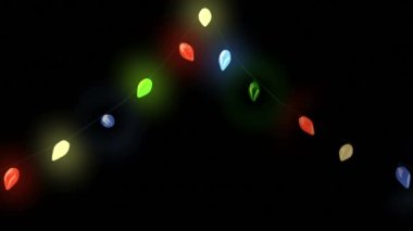 Siyah arka planda renkli noel ışıklarının canlandırılması. Noel gelenekleri, kutlamalar ve dijital olarak oluşturulan şenlik videoları.