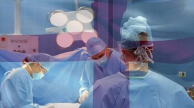 Ameliyathanede cerrahların üzerinde sallanan İngiltere bayrağının animasyonu. küresel tıp, covid 19 pandemik konsept sırasında sağlık hizmetleri dijital olarak üretilen video.