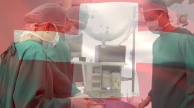 Ameliyathanede cerrahların üzerinde bayrak sallama animasyonu. küresel tıp, covid 19 pandemik konsept sırasında sağlık hizmetleri dijital olarak üretilen video.