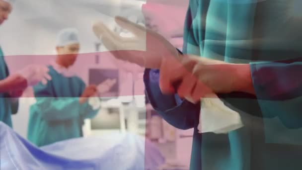Animación Bandera Inglaterra Ondeando Sobre Cirujanos Quirófano Medicina Global Servicios — Vídeos de Stock