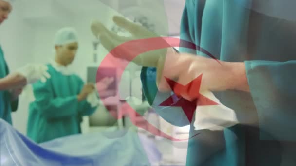 Animación Bandera Algeria Ondeando Sobre Cirujanos Quirófano Medicina Global Servicios — Vídeos de Stock