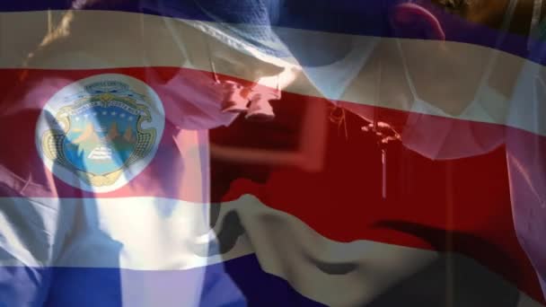 Animazione Bandiera Costa Rica Sventola Sopra Chirurghi Sala Operatoria Medicina — Video Stock