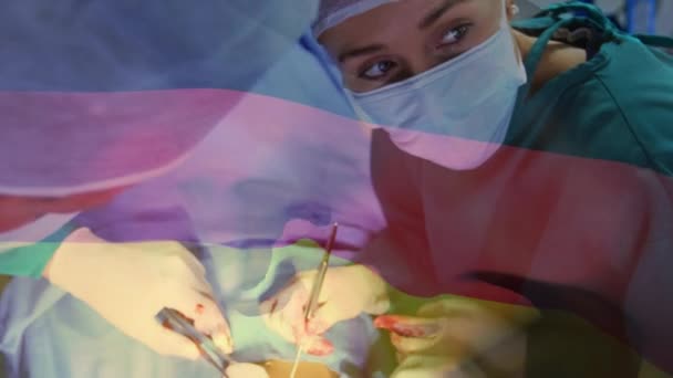 手术室里 德国国旗在外科医生面前飘扬 全球医学 围产期保健服务 数码制作的19种流行病概念视频 — 图库视频影像