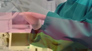 Cerrahların ameliyat odasında sallanan Alman bayrağının animasyonu. küresel tıp, covid 19 pandemik konsept sırasında sağlık hizmetleri dijital olarak üretilen video.