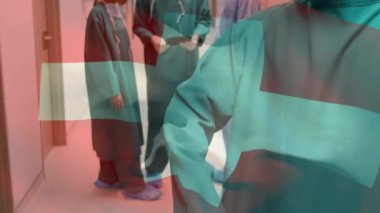 Ameliyathanede cerrahların üzerinde bayrak sallama animasyonu. küresel tıp, covid 19 pandemik konsept sırasında sağlık hizmetleri dijital olarak üretilen video.