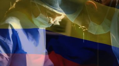 Ameliyathanede cerrahlar yerine Kolombiya bayrağının canlandırılması. küresel tıp, covid 19 pandemik konsept sırasında sağlık hizmetleri dijital olarak üretilen video.