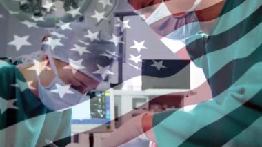 Ameliyathanede cerrahların üzerinde sallanan ABD bayrağının animasyonu. küresel tıp, covid 19 pandemik konsept sırasında sağlık hizmetleri dijital olarak üretilen video.