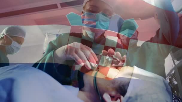 Animación Bandera Croacia Ondeando Sobre Cirujanos Quirófano Medicina Global Servicios — Vídeo de stock