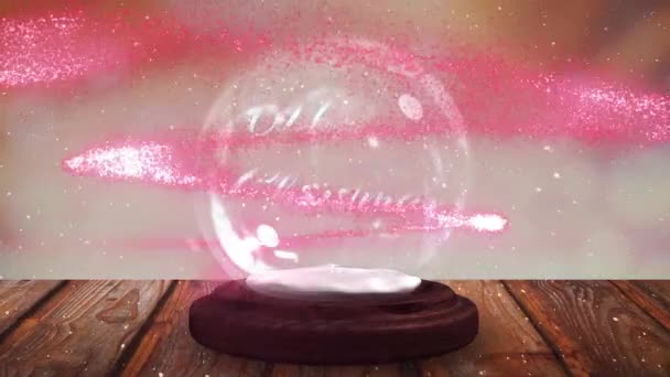 Roze Vallende Ster Rond Vrolijke Kersttekst Een Sneeuwbol Een Houten — Stockvideo