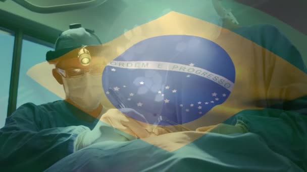 手术室里 在外科医生面前挥动着巴西国旗的动画 全球医学 围产期保健服务 数码制作的19种流行病概念视频 — 图库视频影像