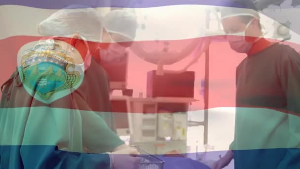 Animación Bandera Costa Rica Ondeando Sobre Cirujanos Quirófano Medicina Global — Vídeo de stock