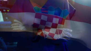Ameliyathanede cerrahın üzerinde sallanan Hırvat bayrağının animasyonu. küresel tıp, covid 19 pandemik konsept sırasında sağlık hizmetleri dijital olarak üretilen video.