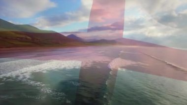 Sahilin ve deniz dalgalarının havadan görüntüsüne karşı İngiltere bayrağı sallamanın dijital bileşimi. Ulusal turizm ve seyahat kavramı