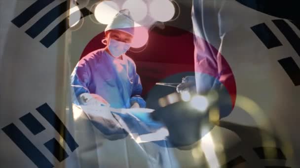 코레아의 수술실에 의사들을 흔들고 세계적 서비스 세계적 유행병 개념을 공고히 — 비디오