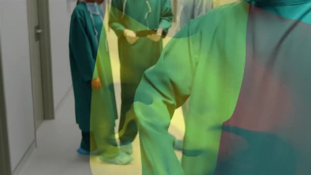 在医院走廊里 飘扬着飘扬在外科医生头上的浪漫旗帜 全球医学 围产期保健服务 数码制作的19种流行病概念视频 — 图库视频影像