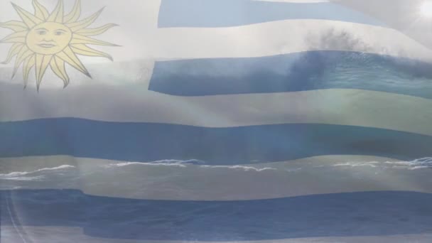 Composição Digital Bandeira Uruguai Acenando Contra Visão Aérea Das Ondas — Vídeo de Stock