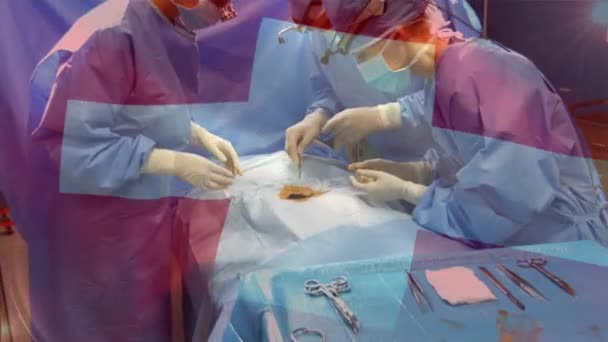 手术室里 在外科医生面前摇曳着天国国旗的动画 全球医学 围产期保健服务 数码制作的19种流行病概念视频 — 图库视频影像
