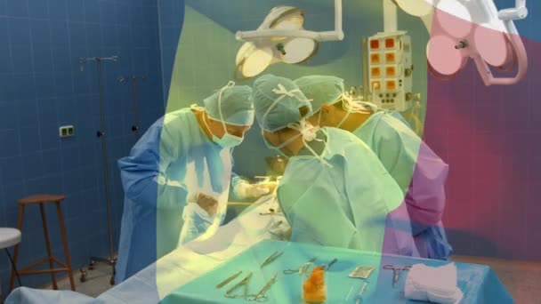 在手术室里 在外科医生面前挥动着战时旗帜的动画 全球医学 围产期保健服务 数码制作的19种流行病概念视频 — 图库视频影像