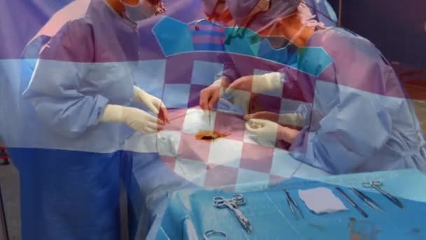 수술하는 수술실의 의사들에게 아티아 깃발을 흔들어 애니메이션 세계적 서비스 세계적 — 비디오
