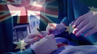 Ameliyathanede cerrahların üzerinde sallanan Avustralya bayrağının animasyonu. küresel tıp, covid 19 pandemik konsept sırasında sağlık hizmetleri dijital olarak üretilen video.