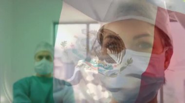 Ameliyathanede cerrahların üzerinde sallanan Bay xico bayrağının animasyonu. küresel tıp, covid 19 pandemik konsept sırasında sağlık hizmetleri dijital olarak üretilen video.