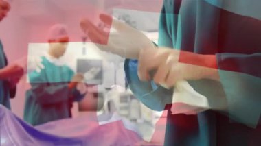 Ameliyathanede cerrahların üzerinde bayrak sallama animasyonu. küresel tıp, covid 19 pandemik konsept sırasında sağlık hizmetleri dijital olarak üretilen video.