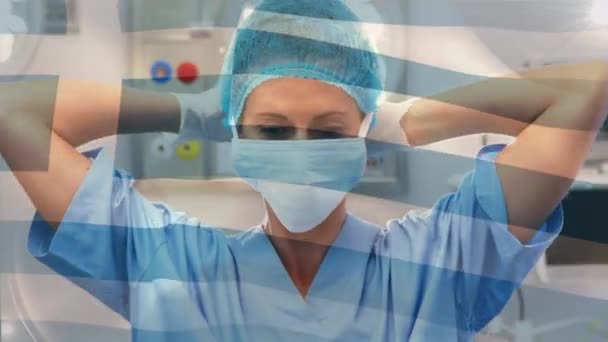 Κινούμενη Σημαία Της Ελλάδας Κυματίζει Πάνω Από Χειρουργούς Στο Χειρουργείο — Αρχείο Βίντεο