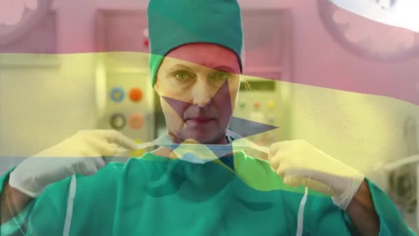Animation Flag Ghana Waving Female Surgeon Operating Theatre Global Medicine — Stock Video