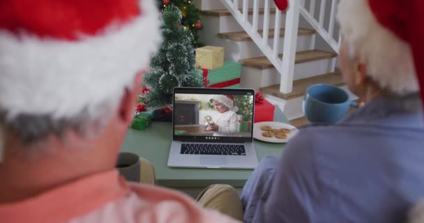 Happy Caucasian Senior Couple Video Call Laptop Grandson Santa Hat — Stock Video