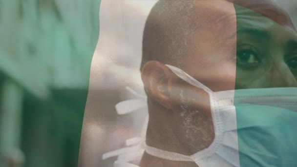 Animación Bandera Nigeria Ondeando Sobre Hombre Con Máscara Facial Durante — Vídeo de stock