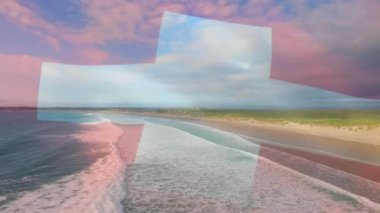 Denizdeki dalgaların havadan görüntüsüne karşı dalgalanan İsviçre bayrağının dijital bileşimi. Ulusal seyahat ve turizm kavramı