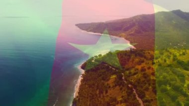 Deniz manzarasına karşı kamerun bayrağı sallamanın dijital bileşimi. Ulusal turizm ve seyahat kavramı