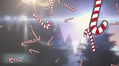 Şeker kamışları, kış manzarasında bir kar küresi içinde Noel yazıtlarına ve eve düşen ikonlar. Noel şenliği ve kutlama konsepti