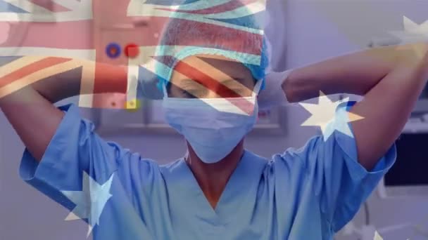 手术室里 在麻醉师面前挥动澳大利亚国旗的动画 全球医学 围产期保健服务 数码制作的19种流行病概念视频 — 图库视频影像