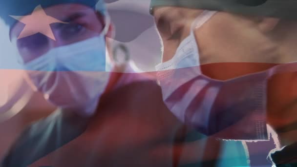 手術室で外科医に手を振るチリの旗のアニメーション 世界中の医療や医療サービスをデジタル化し — ストック動画