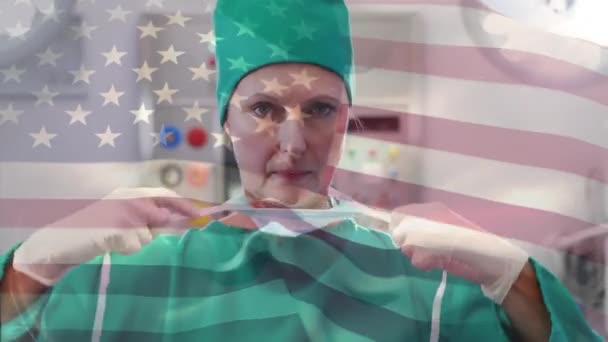 Animación Bandera Ondeando Sobre Cirujana Femenina Quirófano Medicina Global Servicios — Vídeo de stock