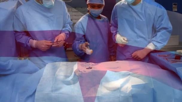 在手术室里 英国国旗在外科医生面前飘扬 全球医学 围产期保健服务 数码制作的19种流行病概念视频 — 图库视频影像