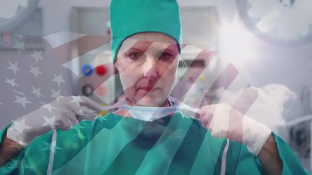 Animation Einer Fahne Die Über Einem Chirurgen Mit Gesichtsmasken Weht — Stockvideo