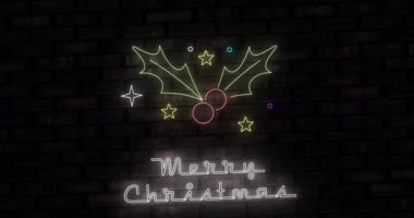 Neon neonlu mutlu noel metninin animasyonu ve siyah arka planda kutsal. Noel, kış, gelenek ve kutlama konsepti dijital olarak oluşturulmuş video.