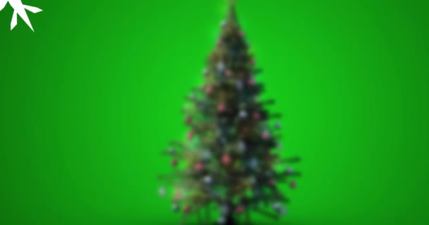 緑の背景にクリスマスツリーに降る雪のアニメーション クリスマス お祝いのコンセプトをデジタルで — ストック動画