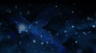 Mavi şekillerin üzerine düşen kar animasyonu hareket ediyor. Noel, gelenek, kutlama ve küresel bağlantılar konsepti dijital olarak oluşturulmuş video.