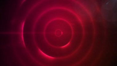 Parlayan dairelerin ve kırmızı uzayda hareket eden ışığın animasyonu. renk, hareket ve dijital arayüz kavramı dijital olarak oluşturulmuş video.