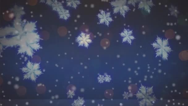 青い背景には 雪のアニメーションがぼやけている クリスマス お祝いのコンセプトをデジタルで — ストック動画