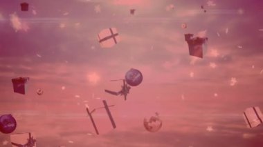 Yıldızlar, noel takıları ve hediye ikonları pembe arka plandaki ışık noktalarına çarpıyor. Noel şenliği ve kutlama konsepti