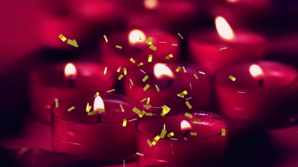 赤いキャンドルの上に落ちる黄金のコンフェッティのアニメーション 誕生日やお祭りやお祝いのコンセプトをデジタルで生成し — ストック動画