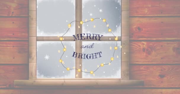 光と冬の雪の窓の上に陽気で明るいクリスマステキストのアニメーション クリスマス お祝いのコンセプトをデジタルで — ストック動画