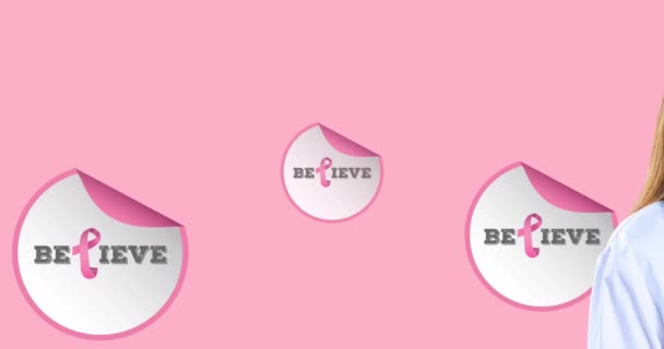 텍스트를 분홍색 배경으로 얼굴을 의사에게 리본을 애니메이션이다 유방암 캠페인은 디지털로 — 비디오