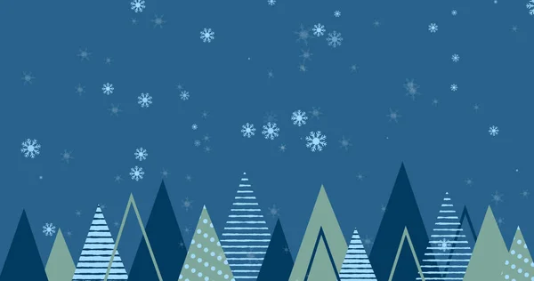 Bild Von Schnee Der Über Weihnachtsbäume Auf Blauem Hintergrund Fällt — Stockfoto