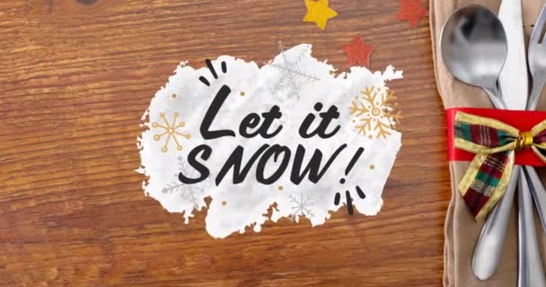 Κινούμενα Σχέδια Αφήστε Χιονίσει Χριστουγεννιάτικο Κείμενο Και Κουτάλι Ξύλινο Τραπέζι — Αρχείο Βίντεο